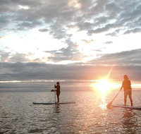 Sunrise Paddleboarding Group Lesson at Palm Cove Beach